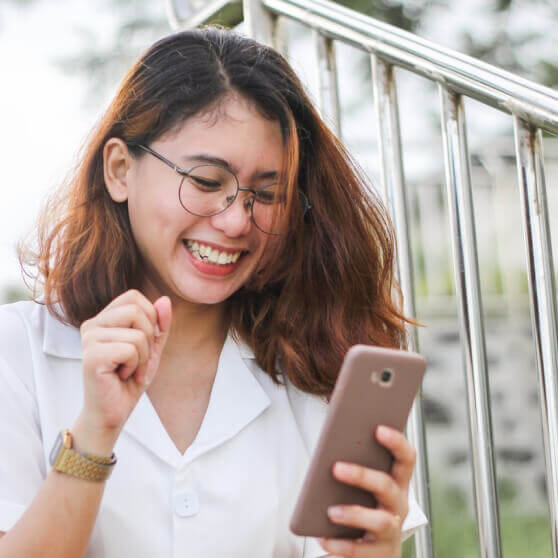 girl smiling on phone